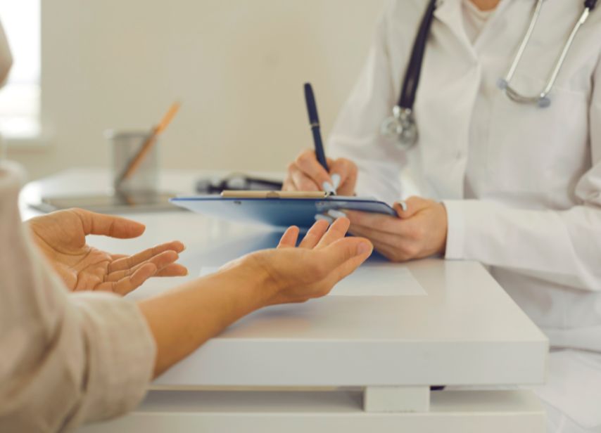 Doctor consulting patient during medical appointment
