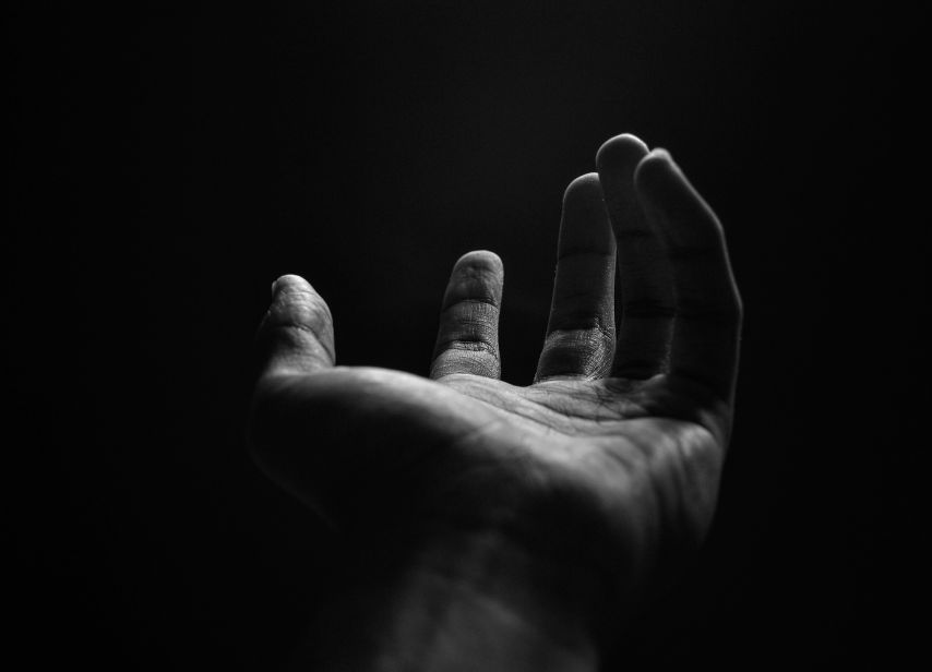 black background and hands